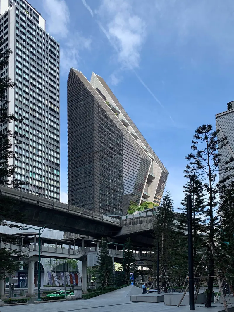 The Rosewood Bangkok tower on Ploenchit Road seen from the street